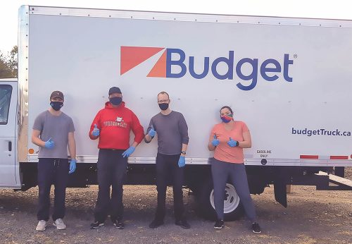 SMNS Volunteers in front of truck wearing PPE