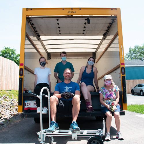 Volunteer movers in back of truck