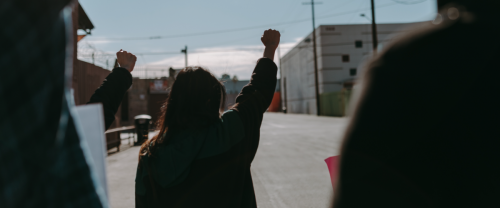 Women raising their fists in the air