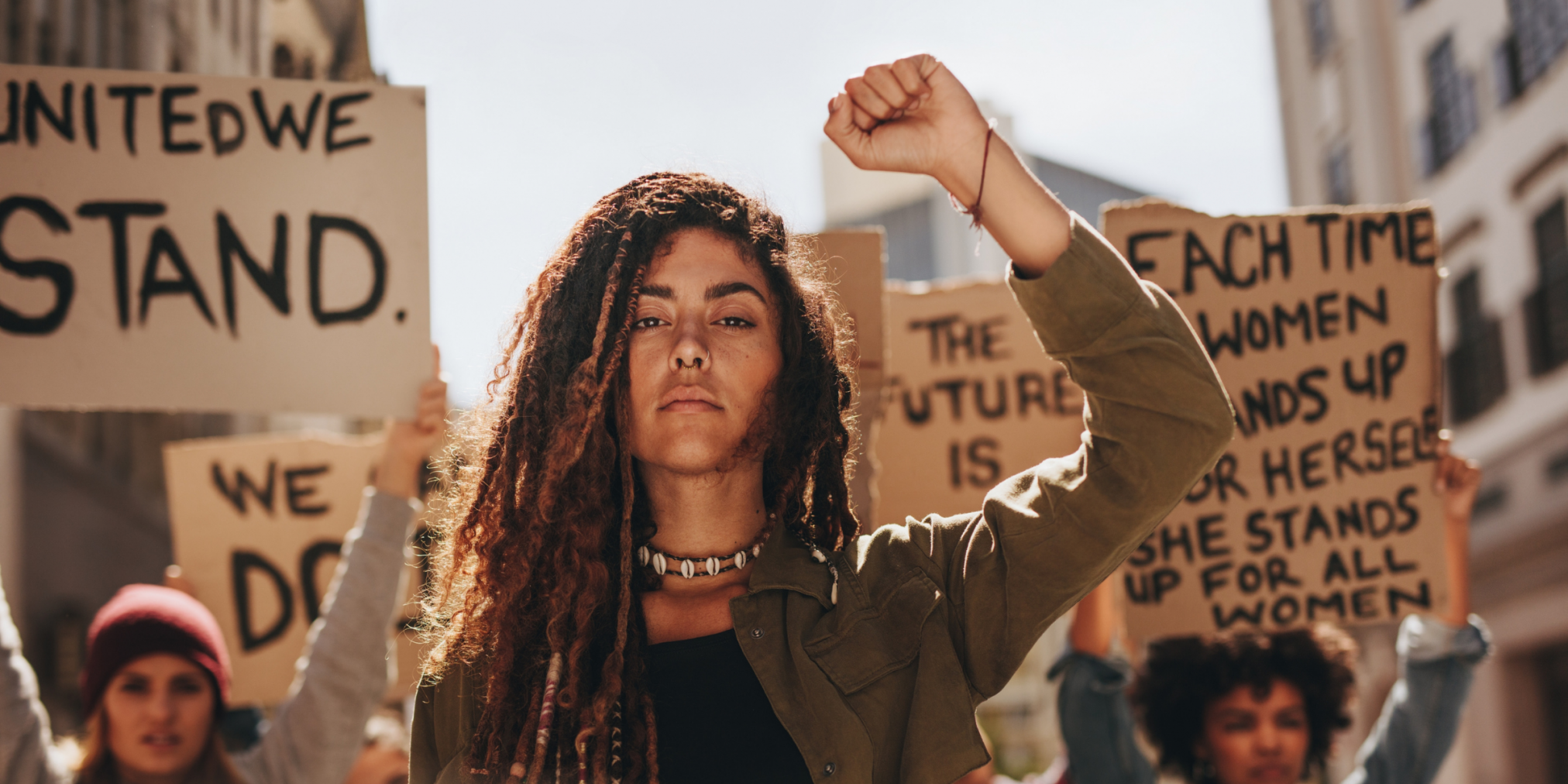 Woman of colour protesting in gender-equality march