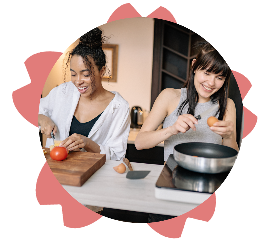 Two young women cooking together