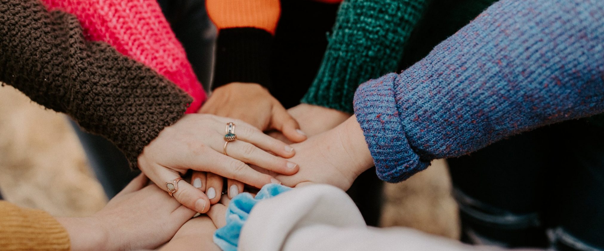 Women's hands piled together