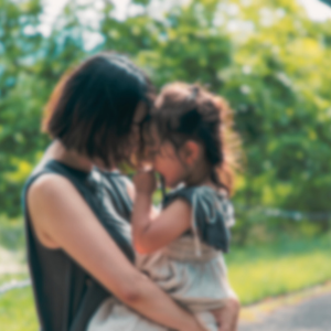 Woman holding young daughter